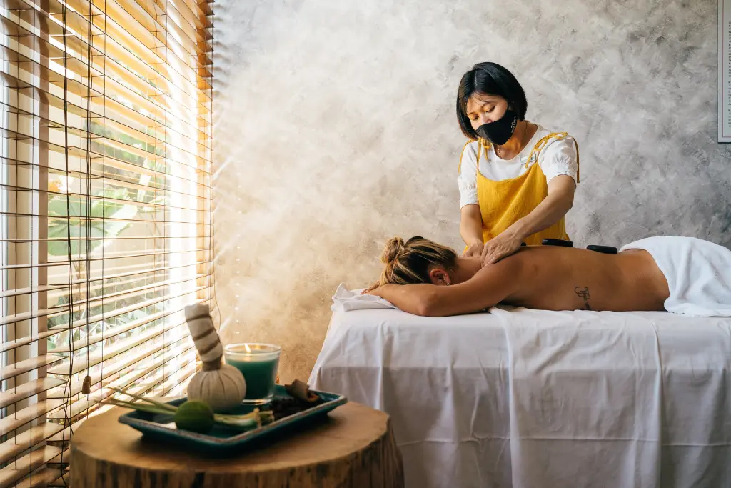 A client enjoys a massage in a calming spa setting. When choosing a lymphatic massage therapist in Rockville.